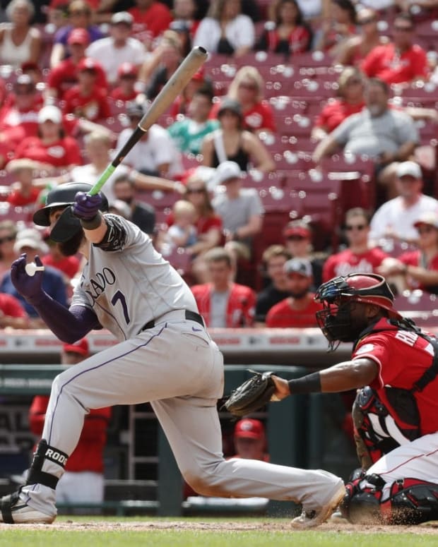 Sep 4, 2022; Cincinnati, Ohio, USA; Colorado Rockies second baseman Brendan Rodgers (7) grounds into a fielders choice scoring a run against the Cincinnati Reds during the ninth inning at Great American Ball Park. Mandatory Credit: David Kohl-USA TODAY Sports